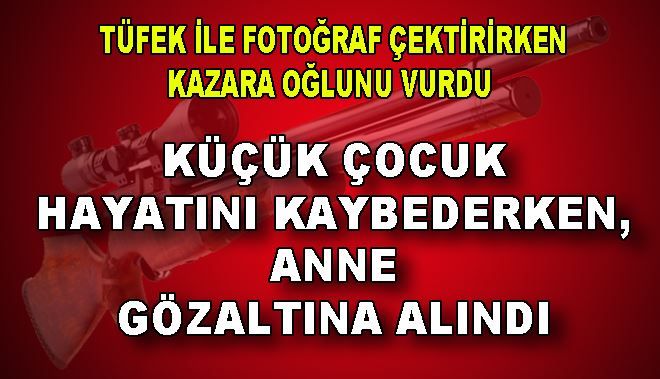 TÜFEK İLE FOTOĞRAF ÇEKTİRİRKEN